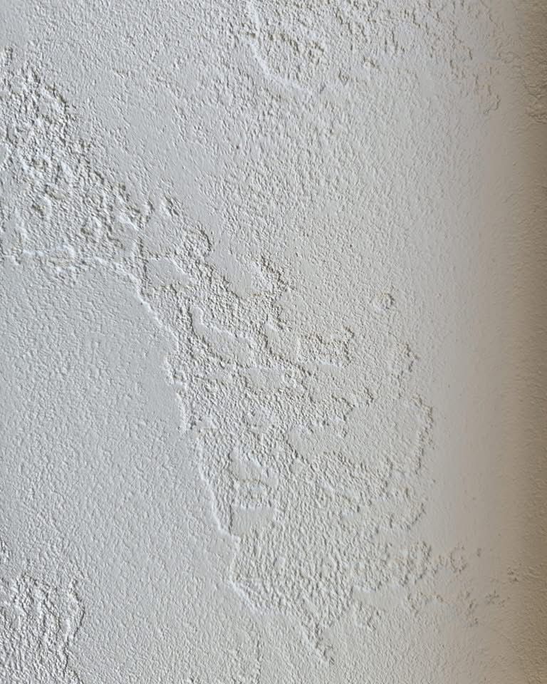Travertino Naturale lime plaster wall finish with characteristic open-pore travertine texture — Silk Plaster